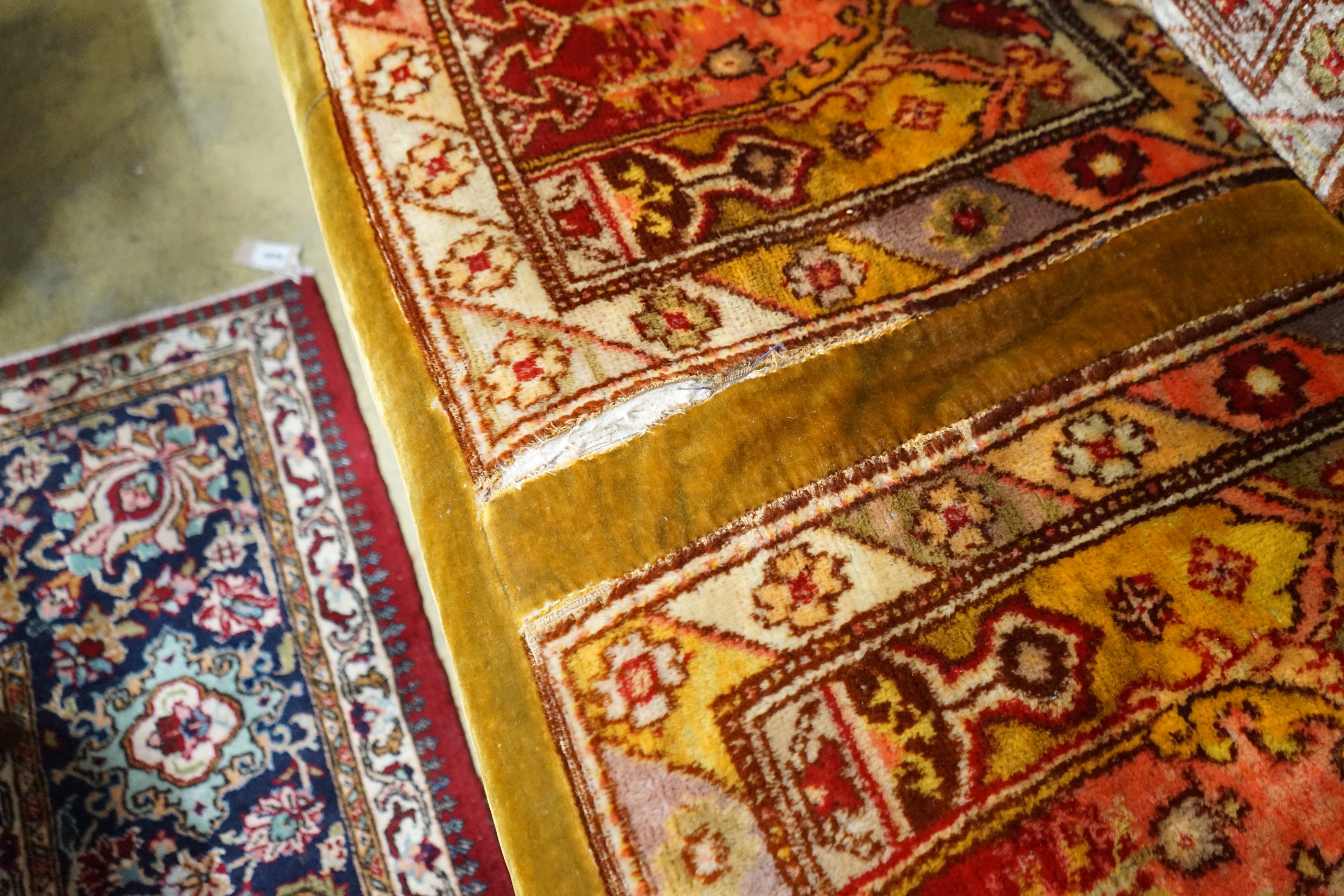 A late Victorian drop arm Chesterfield settee with carpet upholstery, length 175cm, width 78cm, height 80cm